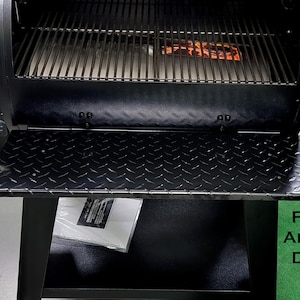 May include: Black metal folding shelf with stainless steel hinges. The shelf is made with powder coated aluminum diamond plate and fits the Pit Boss 700 FB1 grill.
