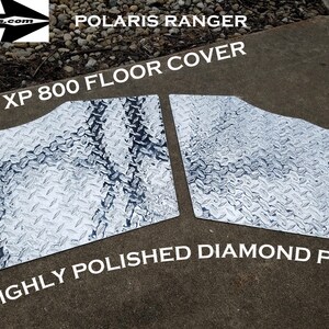May include: Two silver diamond plate floor covers for a Polaris Ranger XP 800. The floor covers are made of highly polished diamond plate.