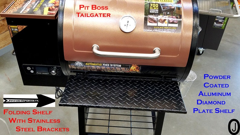 May include: A copper-coloured Pit Boss Tailgater pellet grill with a black base and a folding shelf with stainless steel brackets. The grill has a digital control panel and an automated feed system. The shelf is made of powder-coated aluminium with a diamond plate design.