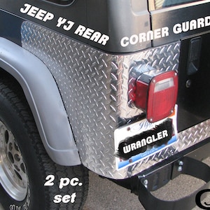 May include: A set of two silver diamond plate corner guards for a Jeep YJ rear bumper. The guards are made of metal and have a textured surface. The image shows the guards installed on a black Jeep Wrangler with a silver rear bumper. The text "Jeep YJ Rear Corner Guards" is visible on the image. The text "2 pc. set" is also visible on the image.