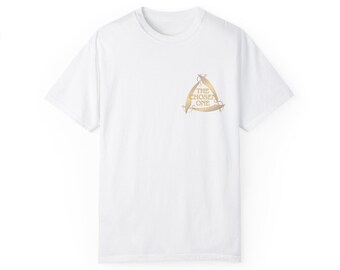 May include: White t-shirt with a gold graphic of a triangle with the text "THE CHOSEN ONE" inside.