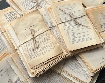 May include: Stacks of aged book pages tied with twine. The pages have a vintage, weathered appearance with visible text. Some bundles are open, revealing text from chapters and prefaces. The overall aesthetic is reminiscent of antique books and literary ephemera.