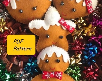 May include: Four felt gingerbread ornaments in a basket with colorful bows. The ornaments are a gingerbread person, a gingerbread heart, a gingerbread star, and a gingerbread circle. The ornaments are all brown with white icing and red bows.