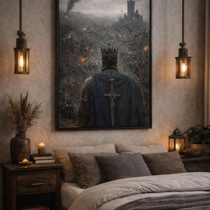 May include: A framed artwork depicts a medieval king in armor, facing a battlefield with a castle in the distance. The king wears a crown and a blue cape with a cross. The scene is set in a bedroom with warm lighting and a bed.
