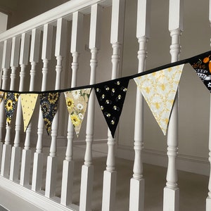 Bee Lovers Honey Hive Inspirational Quote Bee Kind Sunflower Black and Yellow Cotton Fabric Bunting by Bluebell Bunting. Medium bunting tied to the spindles of the stairs landing.