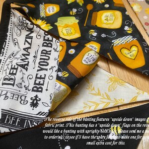 Bee Lovers Honey Hive Inspirational Quote Bee Kind Sunflower Black and Yellow Cotton Fabric Bunting by Bluebell Bunting. Reverse of the bunting features upside down images dependent on fabric print. 8 of the 10 flags are upside down on the reverse.