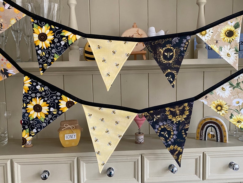 Bee Lovers Honey Hive Inspirational Quote Bee Kind Sunflower Black and Yellow Cotton Fabric Bunting by Bluebell Bunting. Medium and small bunting on a kitchen dresser.