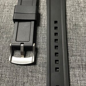 May include: Two black watch straps with silver buckles. The straps are 22mm wide and have a textured surface. One strap has a row of holes for adjusting the size.