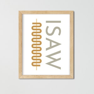 May include: A framed print with the text "I SAW" in gray and a stylized, abstract design in gold.