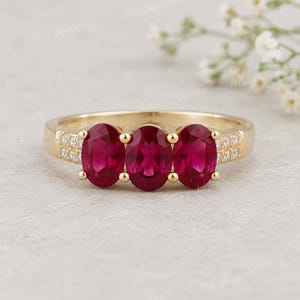 Oval Ruby Trilogy Ring, Gold Statement Ring with Moissanite Accents