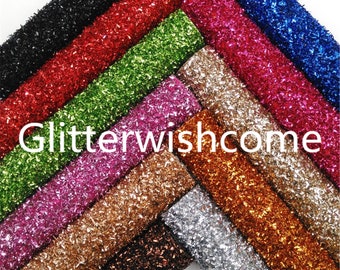 May include: An assortment of glitter sheets in shades like black, red, green, pink, gold, and silver. The sheets are fanned out, with the white text "Glitterwishcome" displayed across the center of the image.