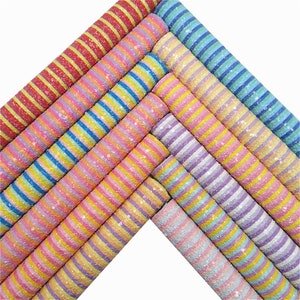 May include: A set of 10 colourful striped fabric sheets with glitter. The stripes are in various shades of pink, blue, yellow, and purple.