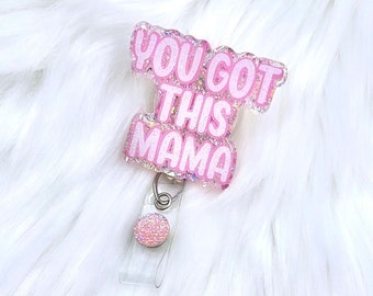 May include: Pink glitter badge holder with a clear plastic clip and a pink glitter circle charm. The badge holder has the text "You Got This Mama" in pink letters.