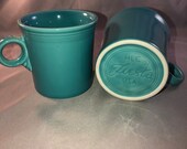 Set of 2 Fiestaware Turquoise ( Newer) Tom Jerry coffee mugs with the ring handle. Mint Condition