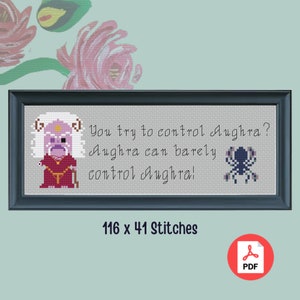 May include: Cross-stitch pattern featuring a purple character with the text "You try to control Aughra? Aughra can barely control Aughra!" and a black spider. The pattern is 116 x 41 stitches.