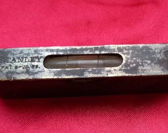 Antique Stanley Steel spirit level brass cover to top japanned black body. Antique American Stanley Steel spirit level brass top plate, gas.