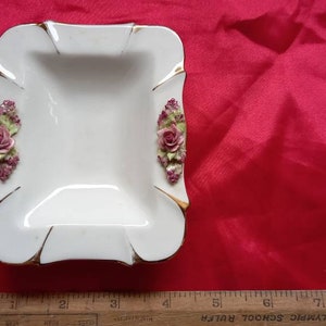Superb ashtray or pin dish perfect condition slight discolouring gold slightly rubed but in perfect condition super little bone china peice