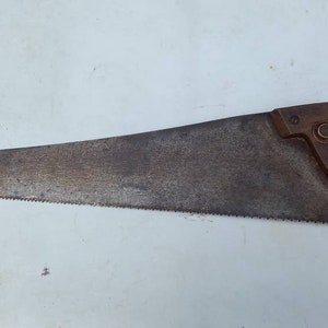 Vintage panel saw used condition lovely patina perfect for using or display item good for a collection or a prop for a TV ad or a TV show