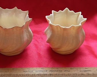 Two Vintage Belleek shell vases three inches tall in superb condition with a luster