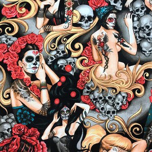 May include: A black and gold fabric with a repeating pattern of skulls, roses, and women with sugar skull makeup. The women are wearing black clothing and have tattoos. The fabric is perfect for crafting projects like clothing, bags, and home decor.