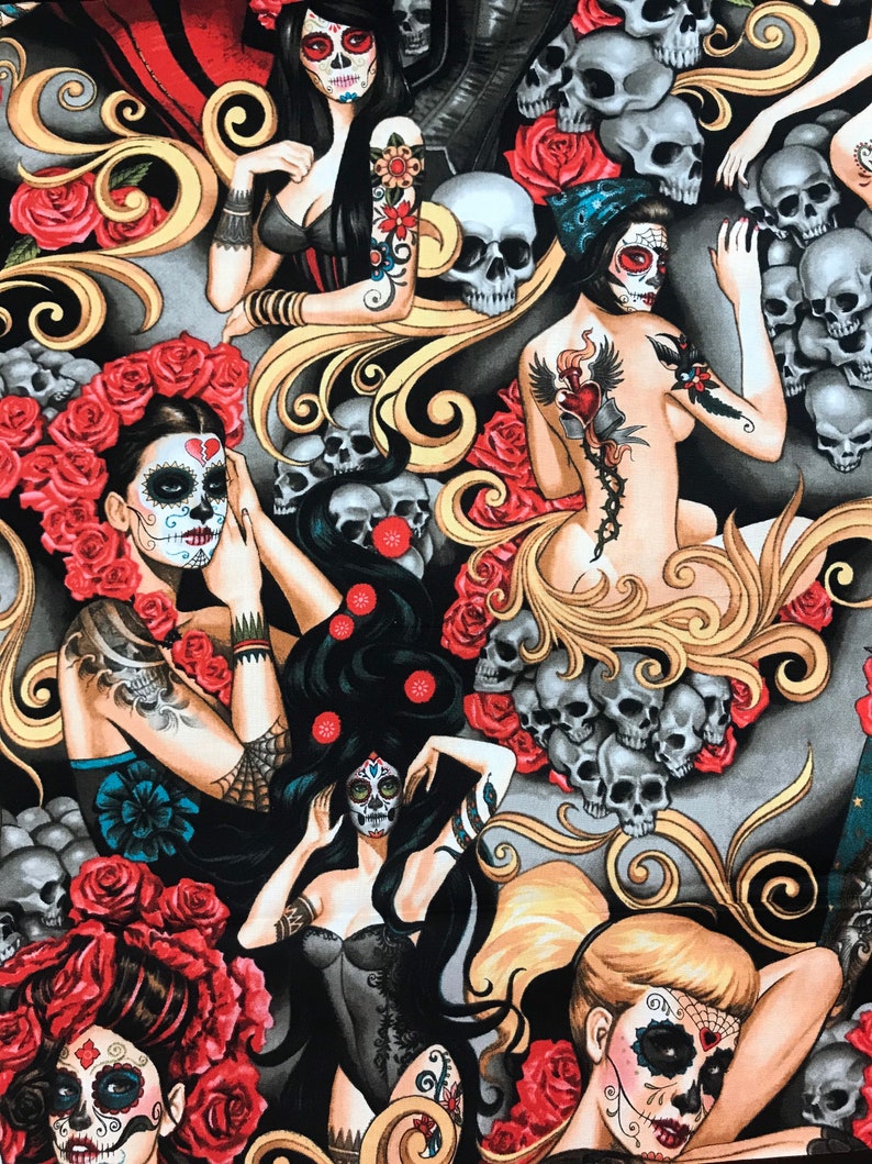 May include: A black and gold fabric with a repeating pattern of skulls, roses, and women with sugar skull makeup. The women are wearing black clothing and have tattoos. The fabric is perfect for crafting projects like clothing, bags, and home decor.
