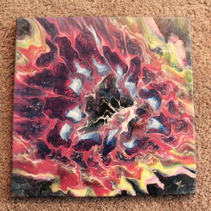 May include: Abstract painting on canvas with swirling patterns in shades of red, black, white, blue, and yellow.