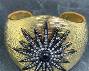 Courtney Kaye gold tone bangle with a black star to the top with oval glass stone Brand New