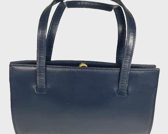 Vintage navy leather handbag, with gold coloured clasp - good condition