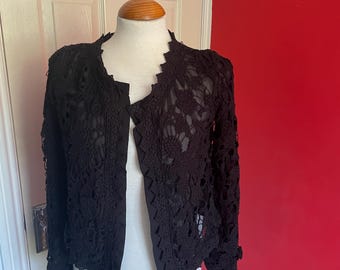 Black lacy jacket made by Simple City size small, pretty top, cardigan, over top shirt