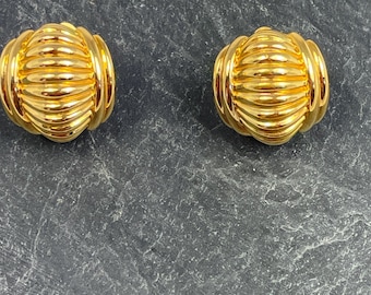 A wonderful pair of 1980's vintage gold tone domed clip on earrings