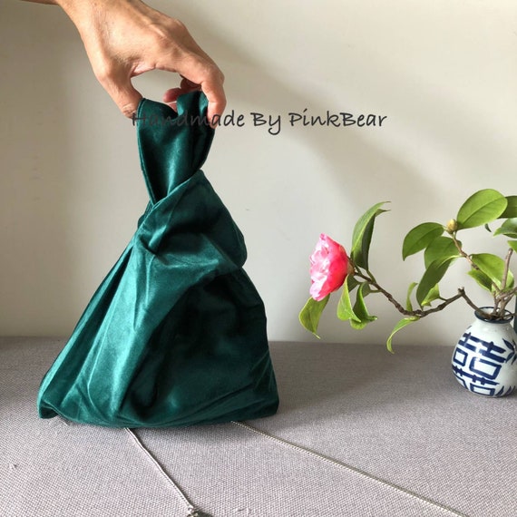 dark green velvet bag