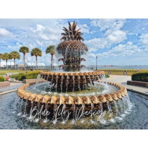 May include: A large, ornate fountain shaped like a pineapple with water cascading down its tiers. The fountain is surrounded by a pool of water and lush greenery. The background features a blue sky with white clouds and a view of a body of water.