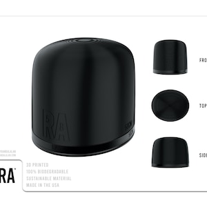 May include: A black 3D printed bottle stopper with the text "RA" and "530" on it. The bottle stopper is 100% biodegradable and made from sustainable materials. It is made in the USA.