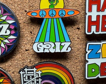 Griz UFO and Griz Rainbow glow in the dark Hard Enamel pins by @musicfestivalstickers