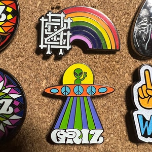 Griz UFO and Griz Rainbow glow in the dark Hard Enamel pins by @musicfestivalstickers