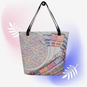 May include: A large tote bag with black shoulder straps featuring a repeating pattern of colorful butterflies in shades of pink, blue, and yellow. The design includes a circular motif on the left and a fan-like arrangement of butterfly wings on the right.