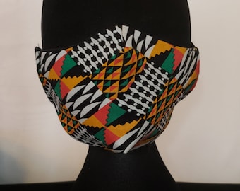 May include: A black face mask with a geometric pattern in shades of yellow, green, red, white, and black.