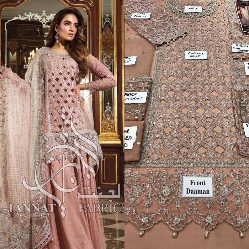 May include: A pink embroidered dress with a matching dupatta. The dress has a cutwork design and is embellished with sequins and pearls. The dupatta is sheer and has a delicate floral pattern. The dress is displayed on a mannequin and is accompanied by several fabric swatches.