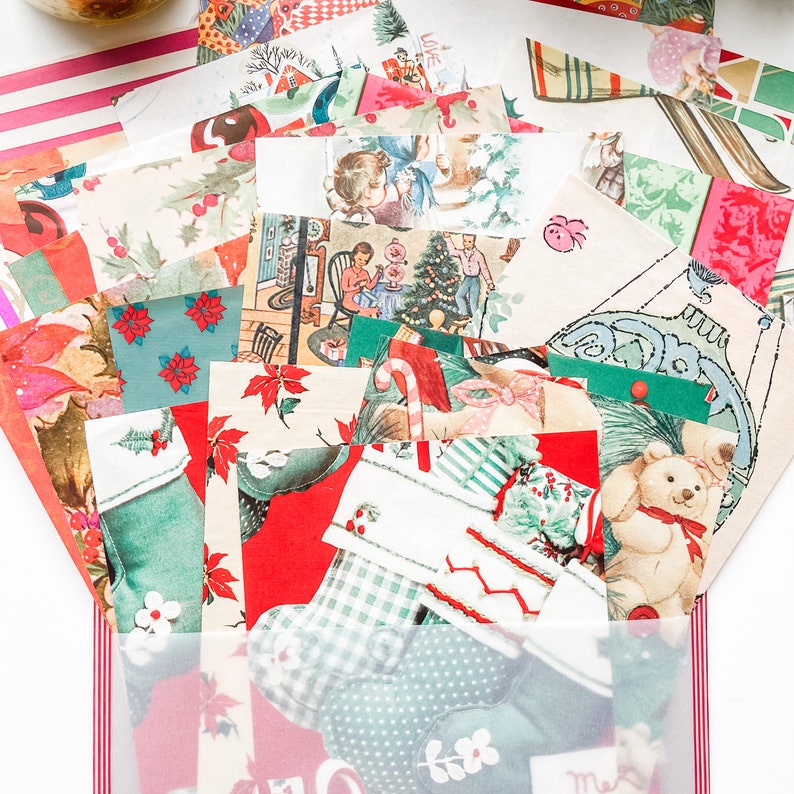 May include: A collection of vintage Christmas wrapping paper scraps in various colors and patterns, including red, green, white, and blue. The paper features images of Christmas trees, Santa Claus, and other holiday motifs.