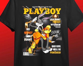 May include: Black t-shirt featuring a parody of a Playboy magazine cover with Bugs Bunny and Lola Bunny. The design includes text that reads "PLAYBOY," "Lola Bunny Interview," and "Spank Me!"