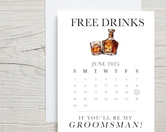 May include: A white card with the text "FREE DRINKS" and a calendar for June 2025 with the number 21 circled. The card also has the text "IF YOU'LL BE MY GROOMSMAN!" and an illustration of a bottle of whiskey and a glass of whiskey.