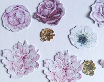 May include: Assortment of paper flowers in various shades of pink, white, and brown. The flowers are cut out and have a delicate, watercolor-like appearance.