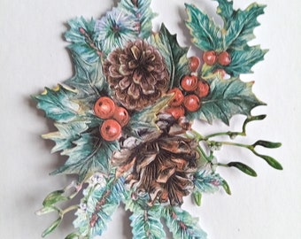 May include: A paper craft embellishment featuring a cluster of pine cones, holly leaves, and red berries. The embellishment is ideal for adding a touch of winter charm to cards, scrapbook pages, and other craft projects.