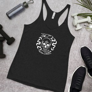 May include: Black racerback tank top with a white graphic of a skull surrounded by snakes and hands.