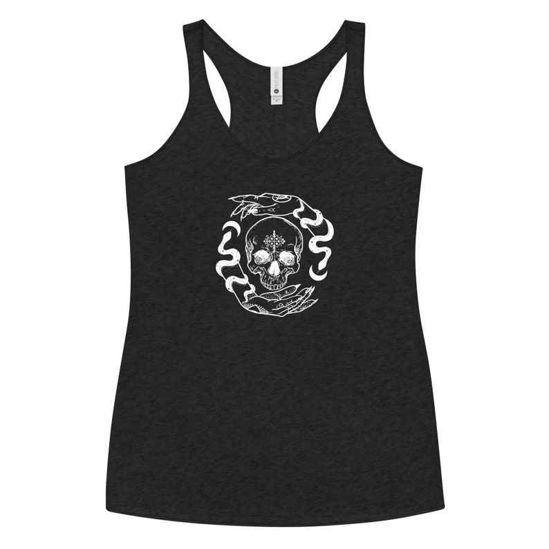 May include: A black tank top with a white graphic of a skull surrounded by two hands and snakes. The skull has a pentagram on its forehead.