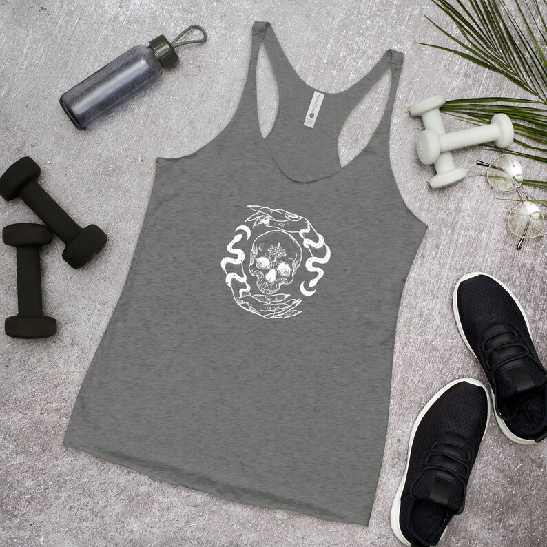 May include: Gray tank top with a white graphic of a skull surrounded by hands and snakes.