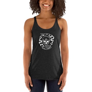 May include: A black racerback tank top with a white graphic of a skull with a flower in its forehead surrounded by two hands and snakes.