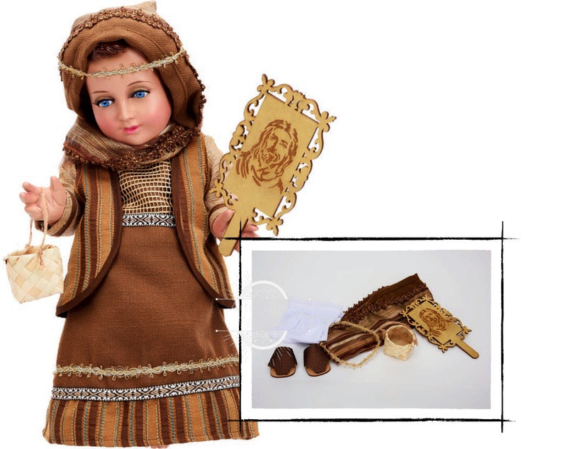 May include: A brown and tan doll dressed in a traditional outfit with a basket and a wooden plaque with a carved image of Jesus. The doll is wearing a brown head covering and a brown and tan dress with a brown belt. The doll is holding a basket in one hand and a wooden plaque in the other hand. The plaque has a carved image of Jesus on it.