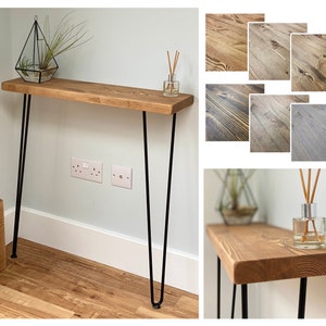 May include: A rustic wooden console table with black hairpin legs. The table is made of reclaimed wood and has a natural finish. The table is 76 cm wide and 41 cm deep.