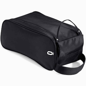 May include: Black shoe bag with a curved design, featuring a top handle and a detachable shoulder strap. The bag has a zippered closure and a small white logo on the side. The bag is made of a durable, water-resistant material.